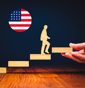 US flag and a hand guiding a figure up steps, representing career opportunities in the United States.