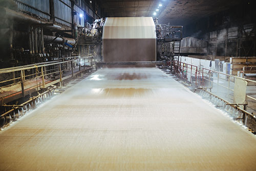 Paper machine process with stock flow, representing fines capture and smoother sheet formation with recycled fiber.