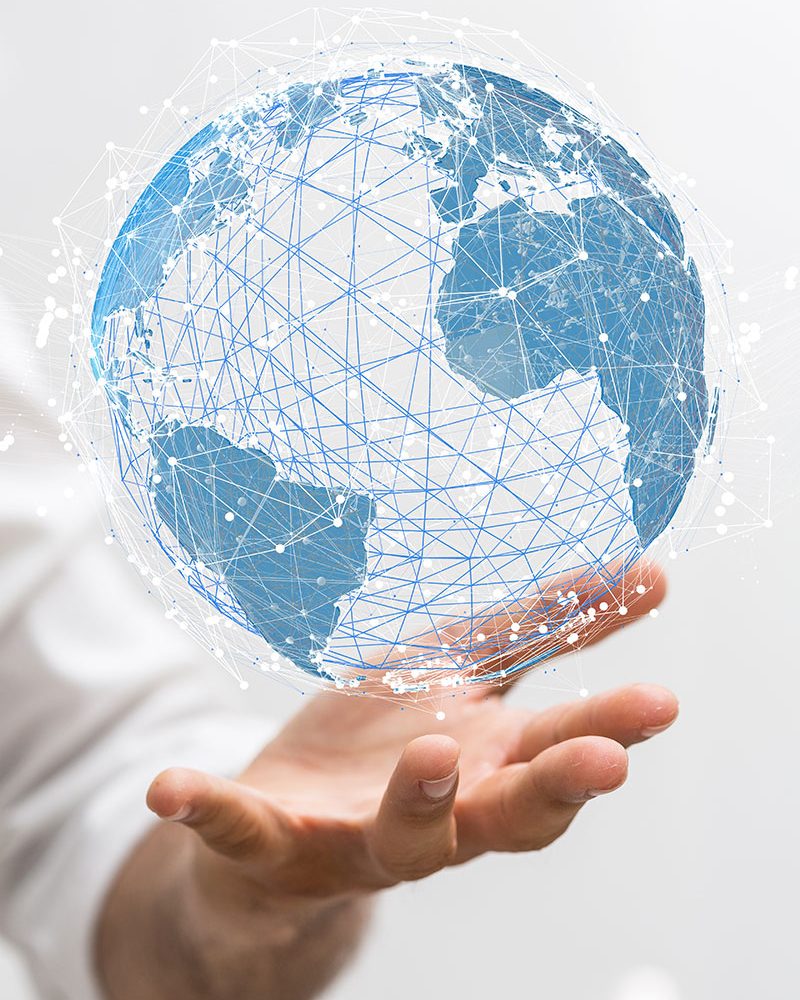 Hand holding a digital globe representing Axchem’s global presence in the pulp and paper industry